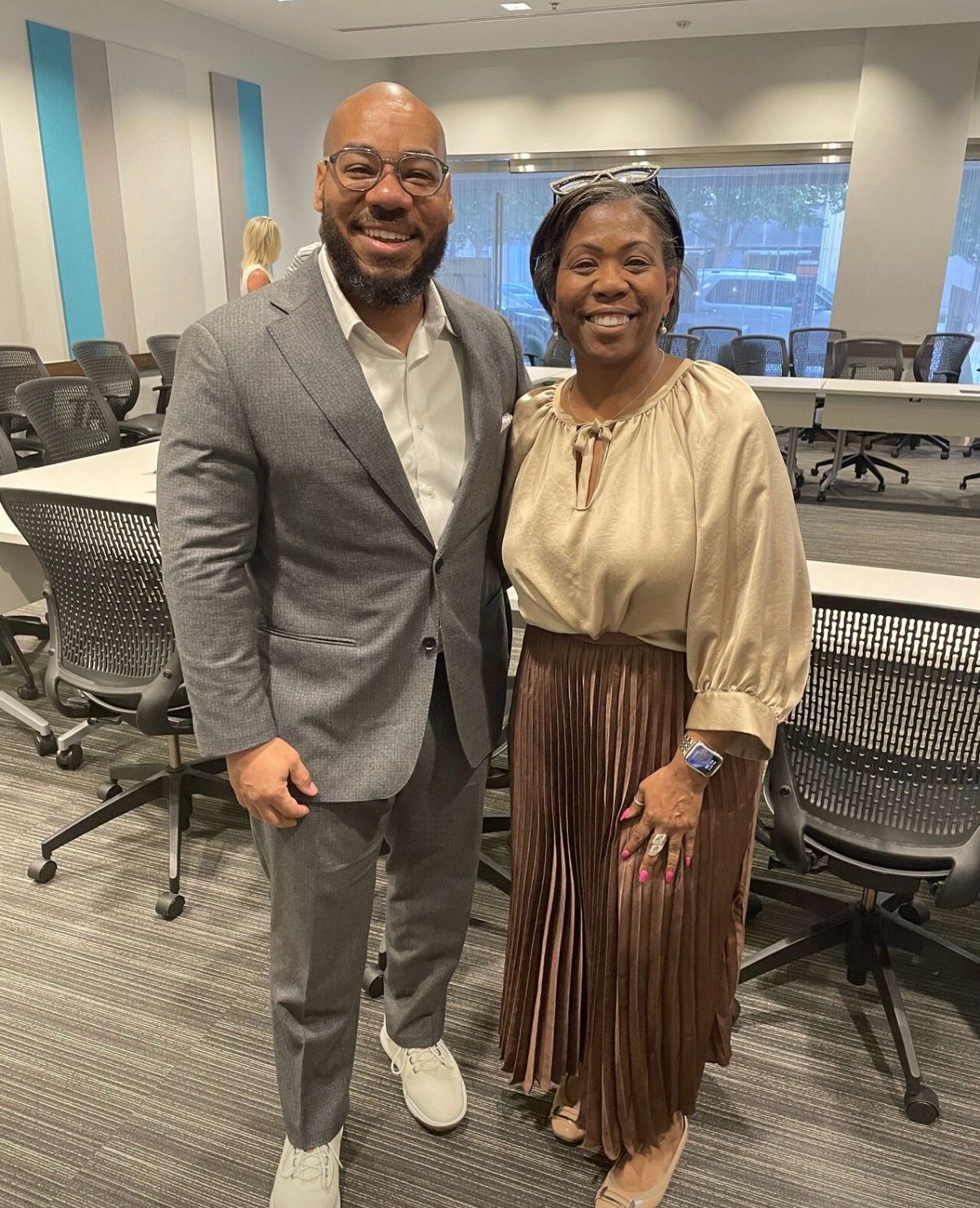 DeMarcus Strange with a professional colleague in a professional setting