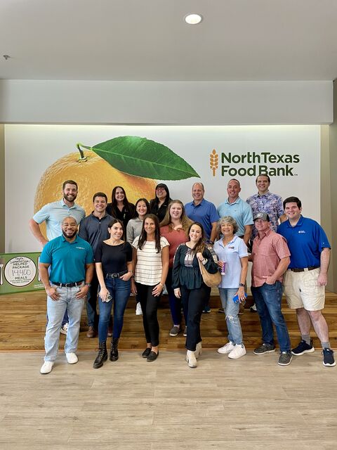 DeMarcus Strange with a group at North Texas Bank