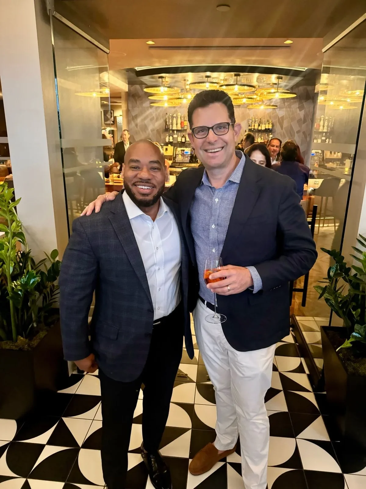 DeMarcus Strange networking with a professional colleague