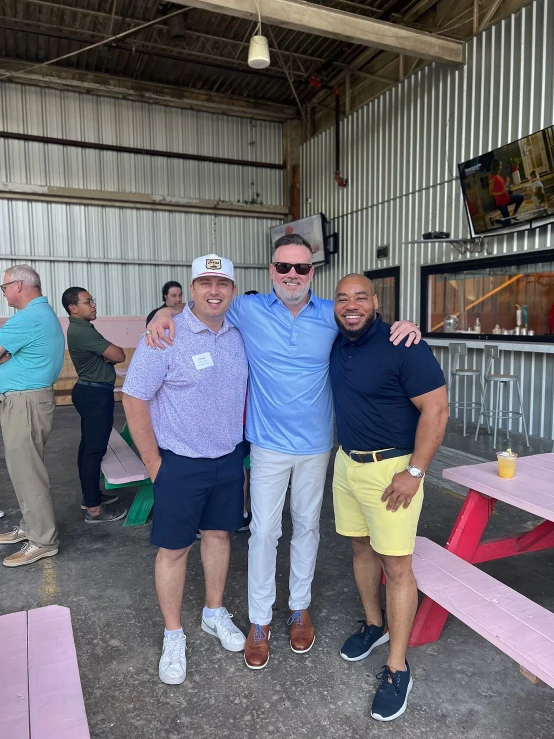 DeMarcus Strange with professional colleagues at a community event