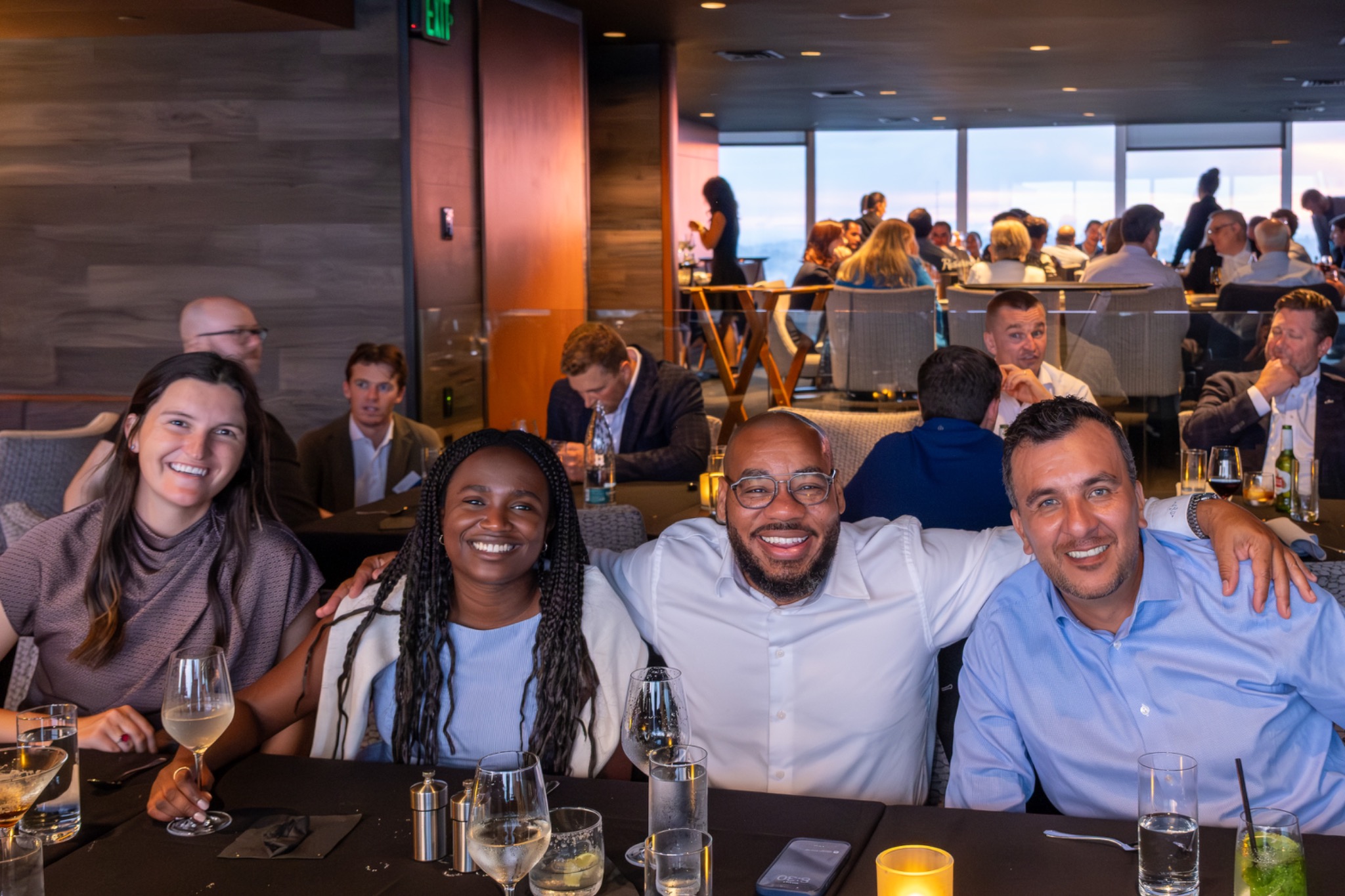 DeMarcus Strange with professional peers at a networking dinner event