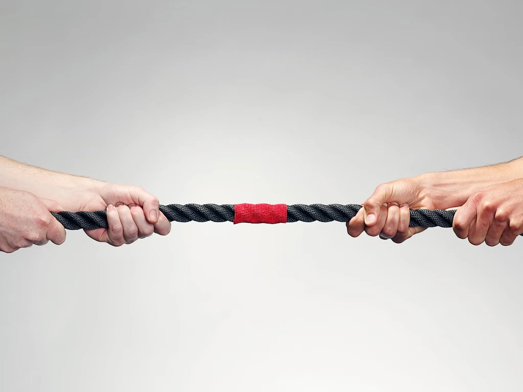 Two sides pulling on a rope in opposing directions